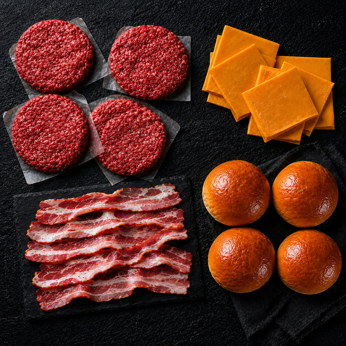 Kit Hamburguesero Tradicional 4 Personas — Hamburguesa res artesanal, pan brioche, cheddar y tocineta · La Carnicerie